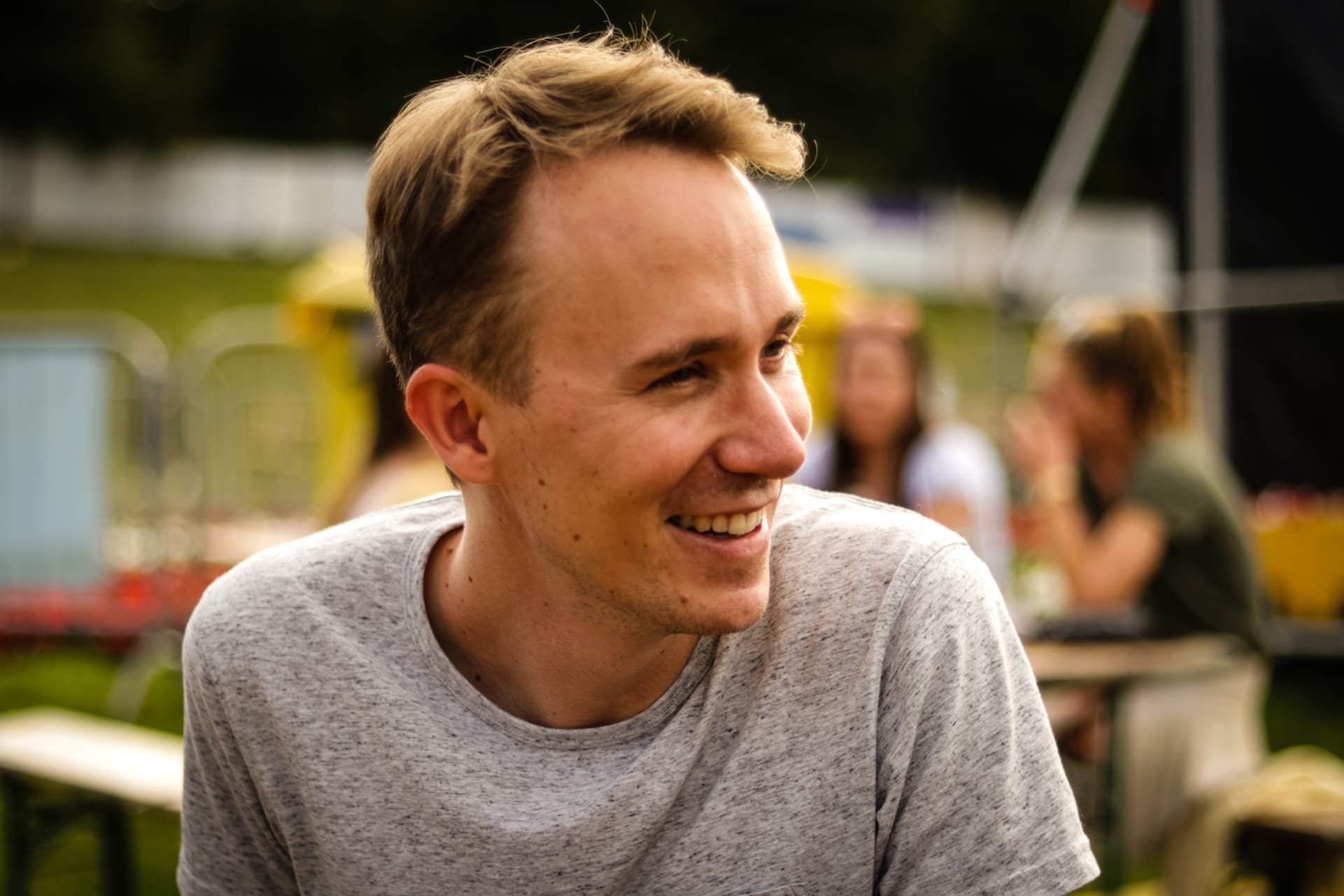 Moritz Keck at an outdoor event, laughing